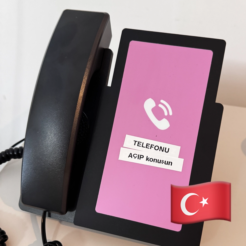 Amical phone set up in Turkish, screen inviting the resident to pick up and talk