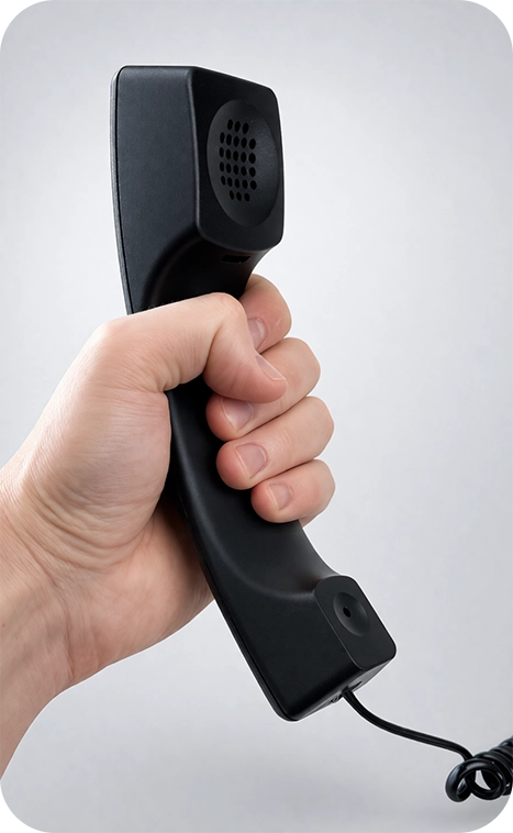 Holding the handset to adjust volume